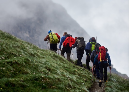Athlete's Edge IV therapy option. Hikers hiking up mountain.