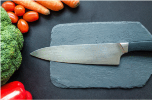 Vegetables and knife on cutting board. Prep for healthy cooking.