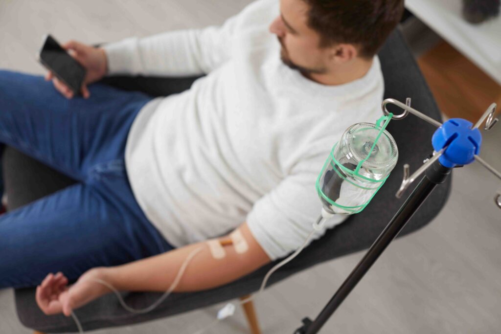 Man getting IV therapy.