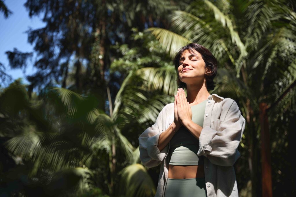 Woman closing eyes and meditating.