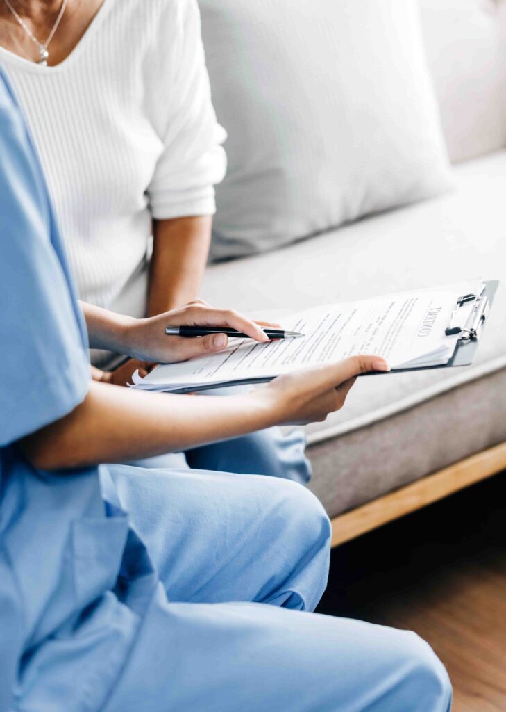 Doctor going over medical papers with patient.