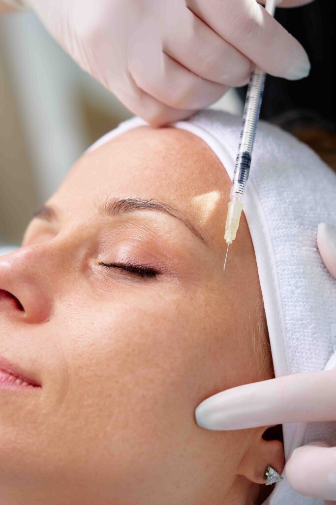 Woman getting botox injections.