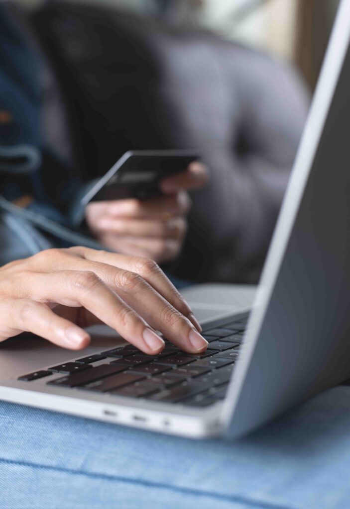 Close up of a person typing on laptop.